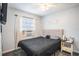 Neat bedroom with a bed, AC, and decor providing a comfortable and simple living space at 1525 W Comanche Ave, Tampa, FL 33603