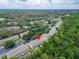The townhouse is surrounded by trees and green space; easy access to neighborhood features and major roads at 15855 Fishhawk View Dr, Lithia, FL 33547
