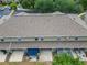 Overhead view of townhouse with neutral exterior, patio, and updated roof in a community with ample parking at 15855 Fishhawk View Dr, Lithia, FL 33547