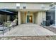 Spacious back patio with an outdoor seating area, perfect for relaxing and entertaining at 15855 Fishhawk View Dr, Lithia, FL 33547