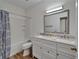 Bathroom features a double sink vanity with marble countertops and a shower-tub combination at 15855 Fishhawk View Dr, Lithia, FL 33547
