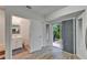 Bedroom with a bathroom and sliding glass door to patio at 15855 Fishhawk View Dr, Lithia, FL 33547