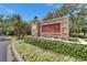 Community entrance sign that reads 'Fishhawk Ridge' nestled among lush greenery at 15855 Fishhawk View Dr, Lithia, FL 33547