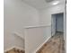Upstairs hallway featuring modern flooring and access to multiple rooms at 15855 Fishhawk View Dr, Lithia, FL 33547