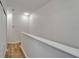 Hallway with modern wood-look flooring and a neutral color palette at 15855 Fishhawk View Dr, Lithia, FL 33547