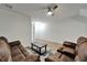Relaxing living room with ceiling fan and view into other rooms of the home at 15855 Fishhawk View Dr, Lithia, FL 33547
