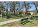 Gathering friendly playground with green space and benches in a natural setting; the perfect place for fun and exercise at 15855 Fishhawk View Dr, Lithia, FL 33547