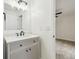 Updated bathroom with modern vanity, sink, mirror, and fixtures at 1801 E Navajo Ave, Tampa, FL 33612
