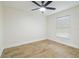 This bedroom features tile floors and a ceiling fan at 1801 E Navajo Ave, Tampa, FL 33612