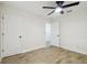 A bedroom with light-colored floors, a closet, and a ceiling fan at 1801 E Navajo Ave, Tampa, FL 33612