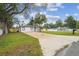 Exterior view showcasing the home's well-maintained lawn and charming street presence at 1801 E Navajo Ave, Tampa, FL 33612