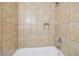 A tiled shower with a built-in niche at 1801 E Navajo Ave, Tampa, FL 33612