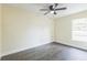 Vacant bedroom featuring wood floors, natural light and a ceiling fan at 1818 Kim Acres Ln, Dover, FL 33527