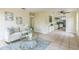 Open-concept living room with a view of the kitchen and a light-filled atmosphere at 1818 Kim Acres Ln, Dover, FL 33527