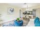 Stylish living room adjacent to the dining area and kitchen at 1818 Kim Acres Ln, Dover, FL 33527