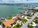 Stunning aerial view showcases waterfront properties, boat docks, and easy access to the bay at 191 1St W St, Tierra Verde, FL 33715