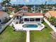 Aerial shot showcasing home's backyard, pool, and outdoor living spaces at 191 1St W St, Tierra Verde, FL 33715