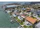 Aerial view of waterfront homes featuring pools, boat docks, and access to the Gulf at 191 1St W St, Tierra Verde, FL 33715