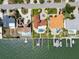 Aerial view of waterfront home showcasing pool, boat dock, and terracotta roof at 191 1St W St, St Petersburg, FL 33715