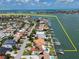 Beautiful aerial view of the neighborhood with waterfront access and private boat docks at 191 1St W St, Tierra Verde, FL 33715