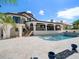 Beautiful Spanish style home featuring a spacious outdoor pool and patio area at 191 1St W St, Tierra Verde, FL 33715