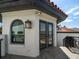 Balcony exterior featuring stone floors, tile roof, and doors providing stunning views of the surrounding landscape at 191 1St W St, Tierra Verde, FL 33715