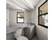 Bright bathroom with light blue countertop vanity and two windows at 191 1St W St, Tierra Verde, FL 33715