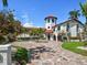 Estate home with circular driveway, tile roof and tropical landscaping at 191 1St W St, Tierra Verde, FL 33715