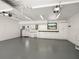 Spacious garage with white cabinets, counter space and an abundance of lighting at 191 1St W St, St Petersburg, FL 33715