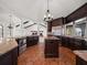 Well appointed kitchen showcasing dark wood cabinetry, granite countertops, and stainless steel appliances at 191 1St W St, Tierra Verde, FL 33715