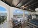 Relax on this covered patio overlooking views of the water and bridge with comfy seating at 191 1St W St, Tierra Verde, FL 33715
