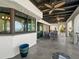 Covered patio with ceiling fans and access to the interior of the home at 191 1St W St, Tierra Verde, FL 33715