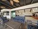 Covered patio featuring comfortable seating, ceiling fans, and bar at 191 1St W St, Tierra Verde, FL 33715