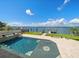 Beautiful swimming pool with a unique design, adjacent to waterfront at 191 1St W St, Tierra Verde, FL 33715