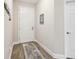Bright entryway with wood-look tile flooring and a stylish rug at 19323 Hawk Valley Dr, Tampa, FL 33647