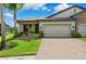 Charming one-story home with manicured landscaping and a two-car garage at 19323 Hawk Valley Dr, Tampa, FL 33647