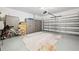 Spacious two-car garage with epoxy flooring and ample storage cabinets at 19323 Hawk Valley Dr, Tampa, FL 33647