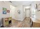 Inviting hallway featuring wood-look floors and decorative wall art at 19323 Hawk Valley Dr, Tampa, FL 33647