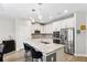 Bright kitchen featuring a large island with bar seating and stainless appliances at 19323 Hawk Valley Dr, Tampa, FL 33647