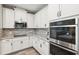Close-up of modern kitchen appliances and granite countertops at 19323 Hawk Valley Dr, Tampa, FL 33647