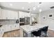Open kitchen with a center island, pendant lighting, and stainless appliances at 19323 Hawk Valley Dr, Tampa, FL 33647