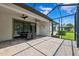 Covered patio with outdoor seating, perfect for enjoying the serene backyard view at 19323 Hawk Valley Dr, Tampa, FL 33647