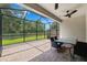 Screened-in patio with brick flooring, perfect for outdoor dining and entertaining at 19323 Hawk Valley Dr, Tampa, FL 33647