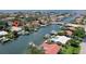 Aerial view of the waterfront home and neighborhood with navigable access to the ocean waters at 2017 Iowa Ne Ave, St Petersburg, FL 33703