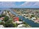 Aerial view showcasing a waterfront property with lush greenery and a convenient location at 2017 Iowa Ne Ave, St Petersburg, FL 33703