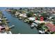 Aerial view of waterfront home with pool and boat dock on a canal with easy access to open waters at 2017 Iowa Ne Ave, St Petersburg, FL 33703