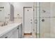 Bathroom featuring a vanity, toilet, and glass-enclosed shower at 2017 Iowa Ne Ave, St Petersburg, FL 33703
