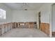 Bedroom needing renovation, featuring exposed wall studs and large windows at 2017 Iowa Ne Ave, St Petersburg, FL 33703