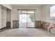 Bedroom leading to a patio with exposed wall studs ready for renovation at 2017 Iowa Ne Ave, St Petersburg, FL 33703