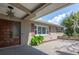 Home exterior showcasing the front entryway with brick pavers, shutters, and a well-kept landscape at 2017 Iowa Ne Ave, St Petersburg, FL 33703